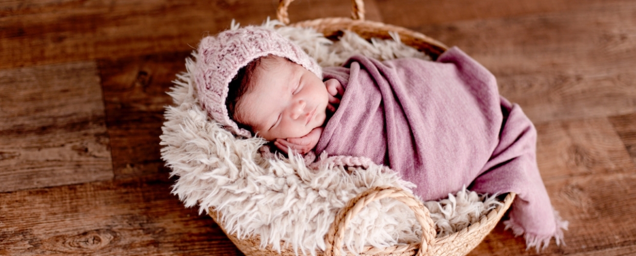 baby in taupe wrap